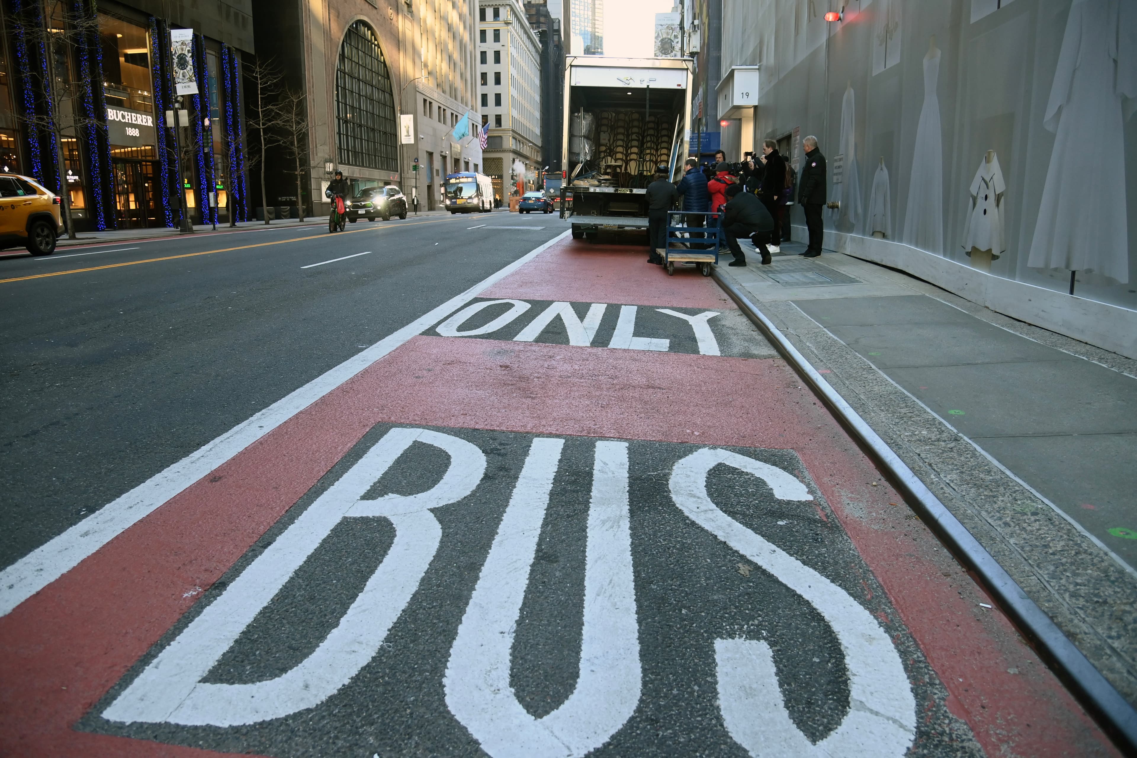 Delivery truck occupying a marked red bus lane